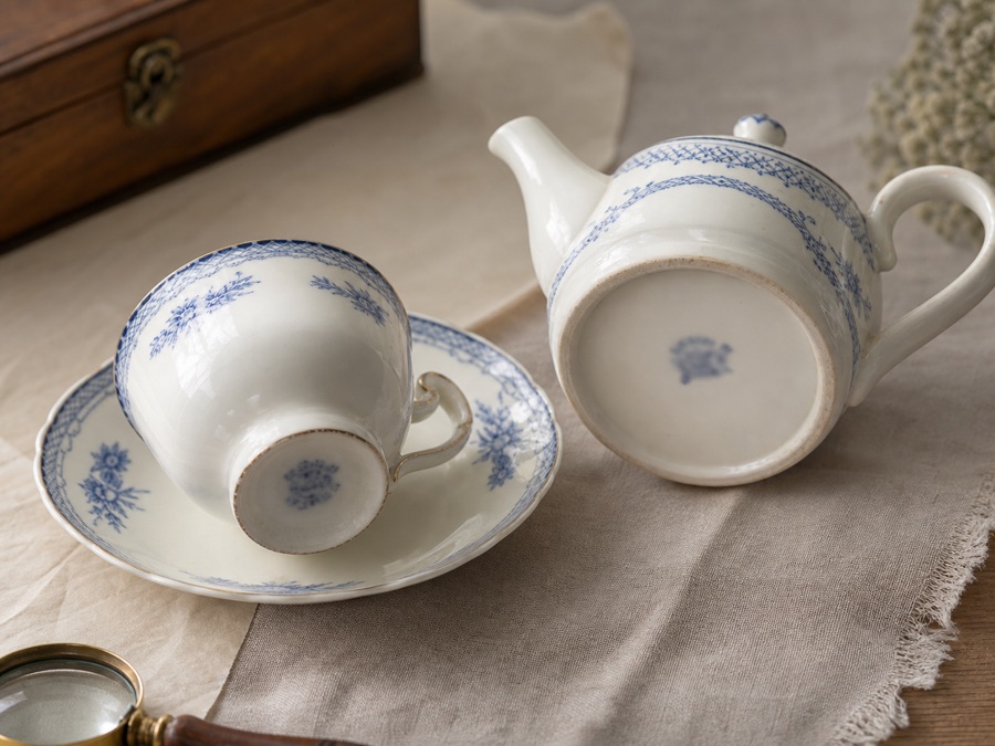 Vintage porcelain tea set prepared for inspection